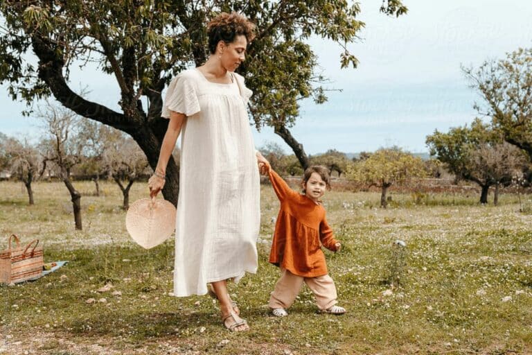 mom and daughter walking in the nature